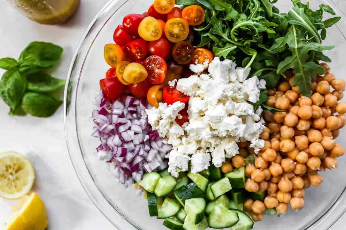 orzo salad ingredients in bowl.