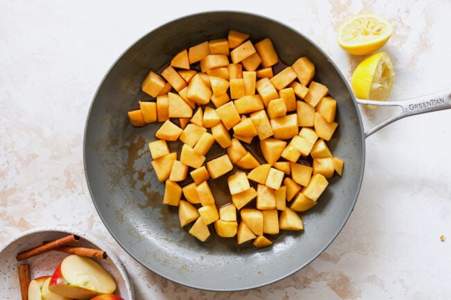 cinnamon apples cooking in skillet