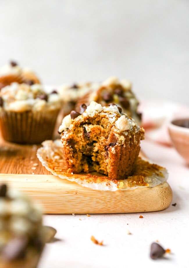 Pumpkin chocolate chip muffins with a bite taken out