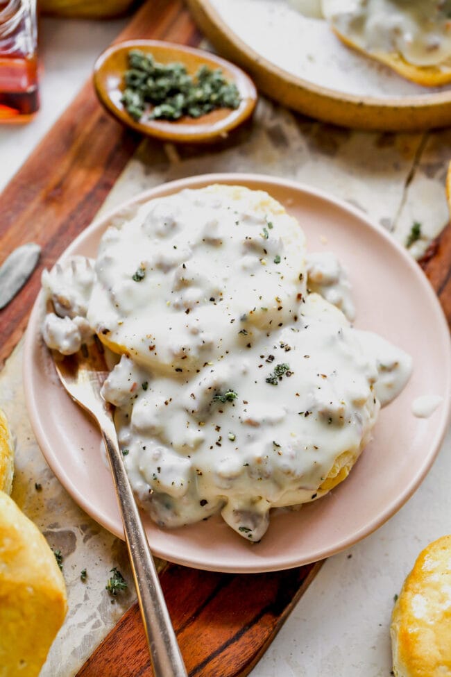 sausage gravy and biscuits on plate
