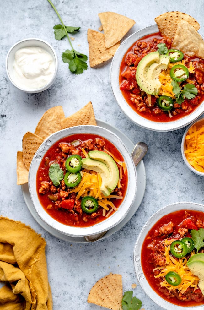 chili with no beans in bowls with toppings 