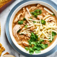 Overhead view of a bowl of white chicken chili garnished with fresh cilantro.