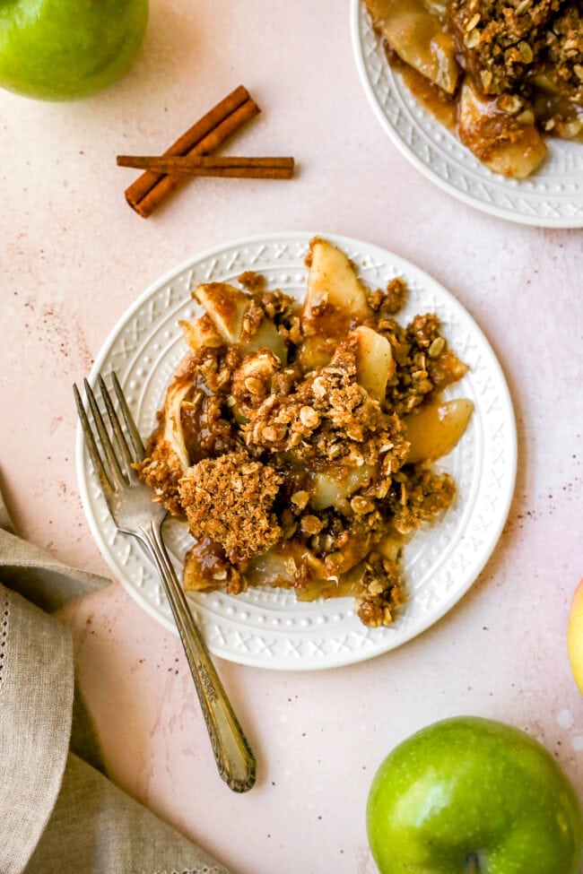Apple crumble on plate with fork.