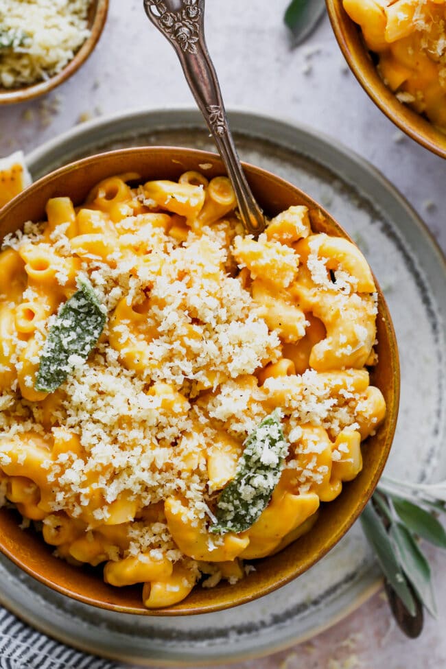 pumpkin mac and cheese with brown butter panko topping in bowl