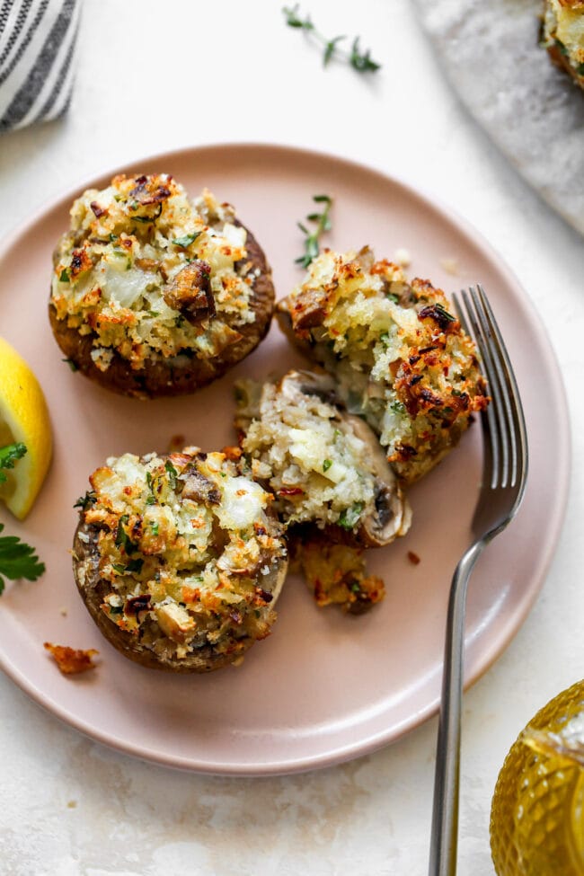 stuffed mushrooms on plate with fork.