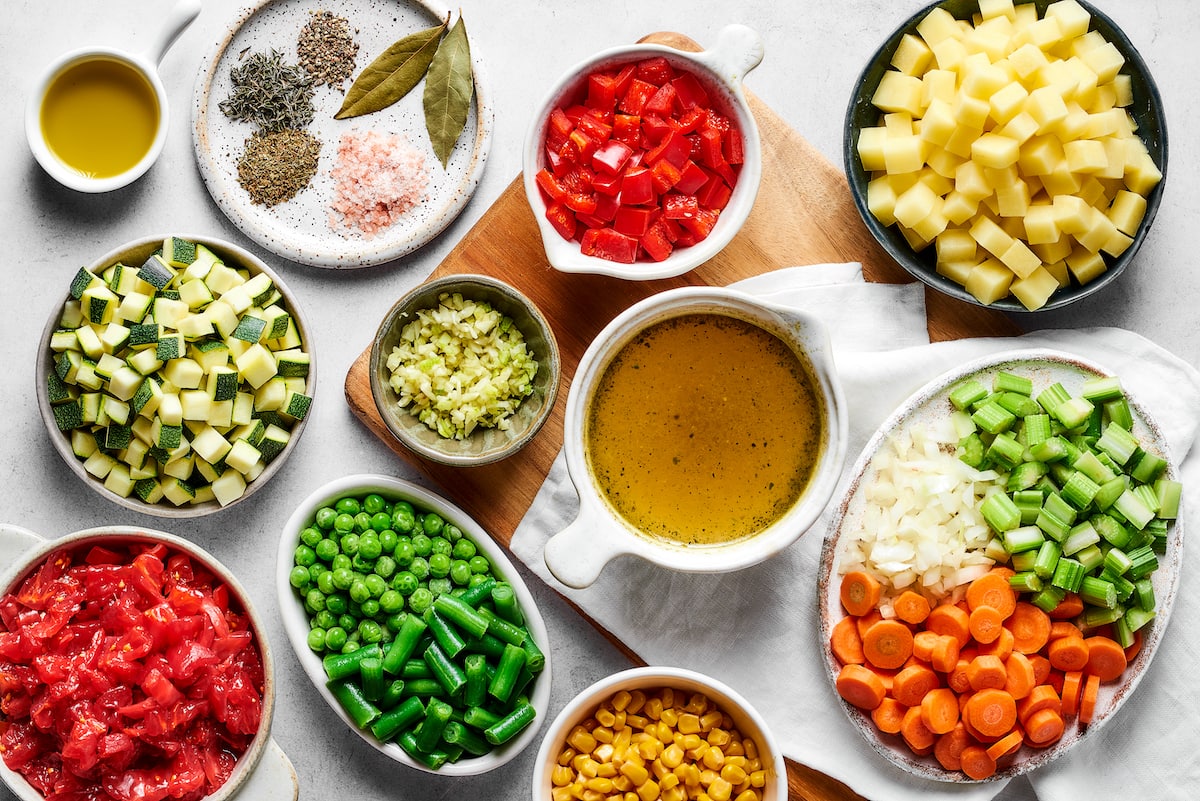 This comforting homemade vegetable soup recipe is a family favorite that's so much better than canned soup! Enjoy a bowl for lunch or dinner. The ingredients for homemade vegetable soup.