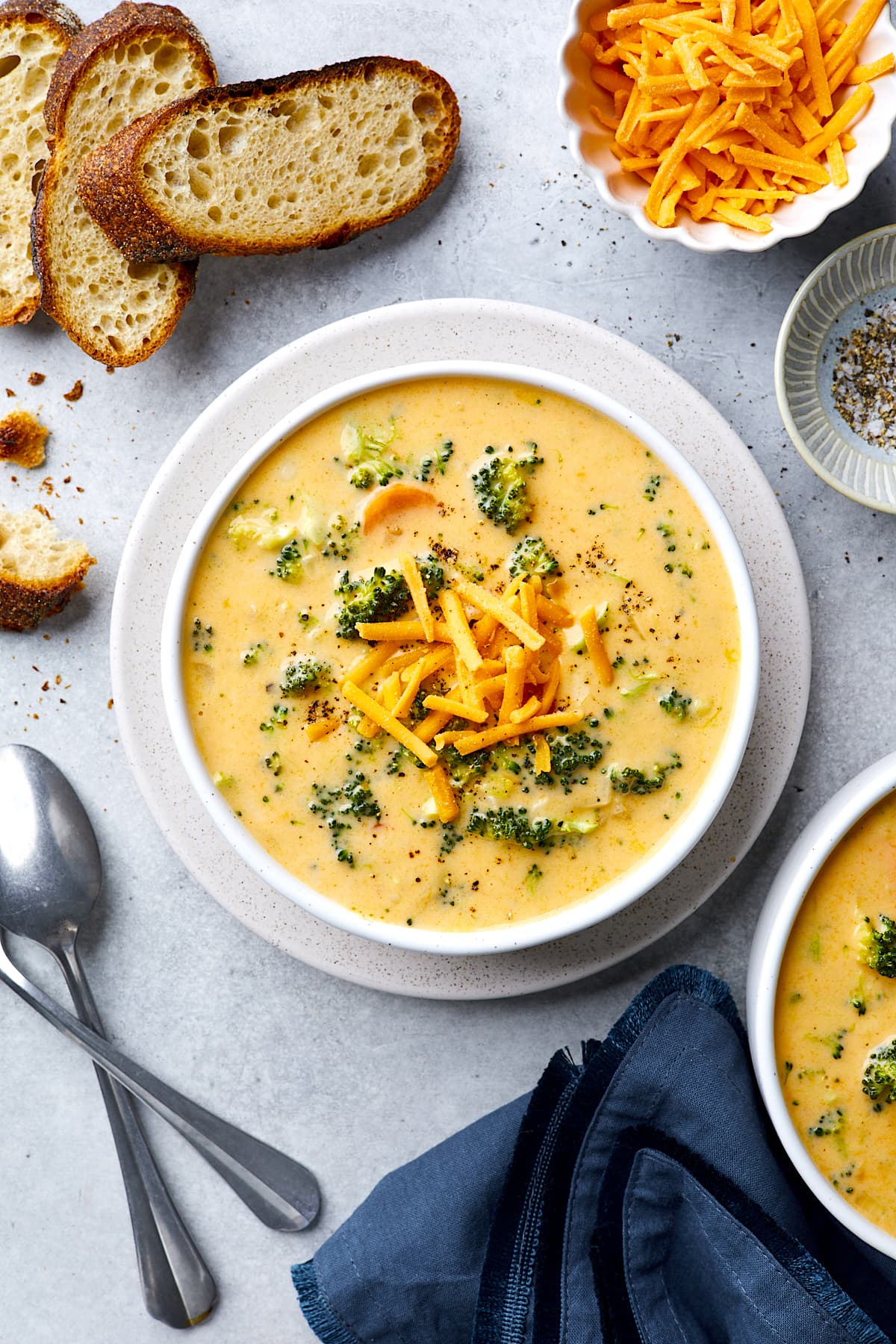 Broccoli Cheese Soup in bowl on plate. 