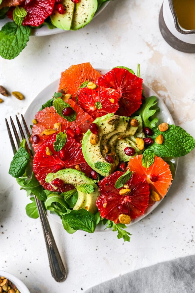 citrus salad on plate with fork