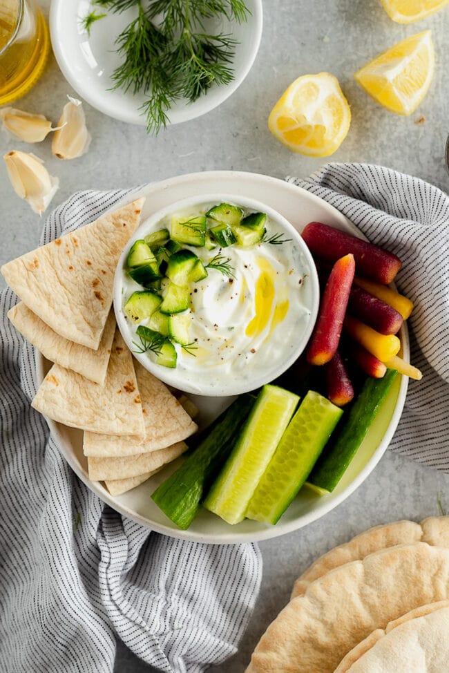 tzatziki sauce with veggies and pita bread