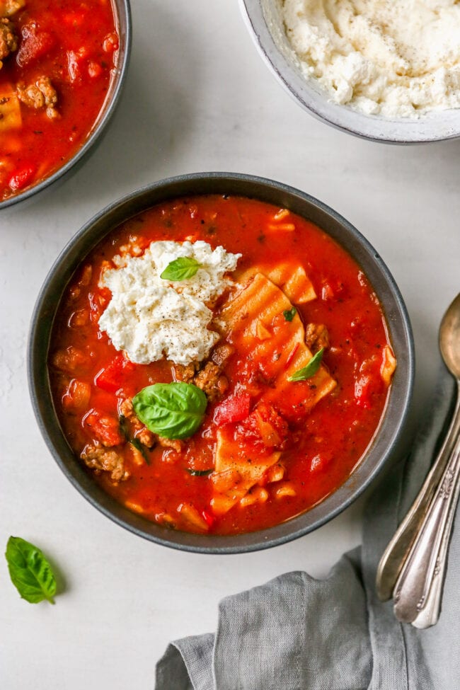 Lasagna soup in bowl with ricotta cheese