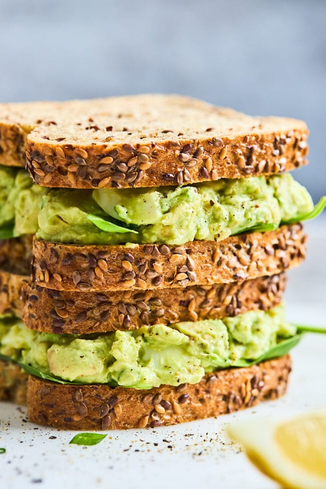 avocado egg salad sandwich stacked 