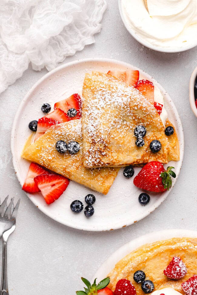 crepes with berries on plate