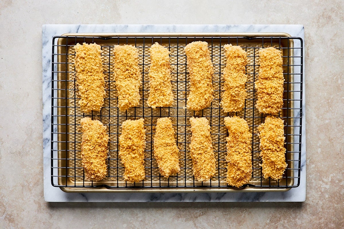 fish sticks on wire rack on baking sheet. 