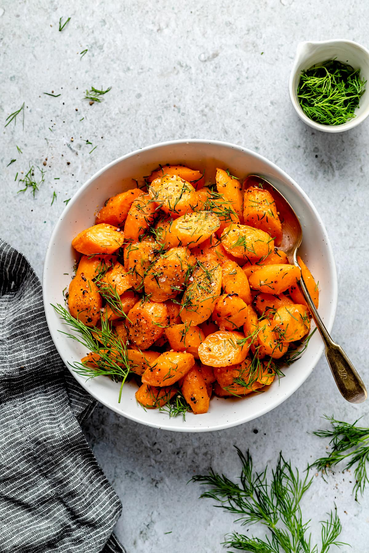 Roasted Carrots in a bowl with fresh dill.