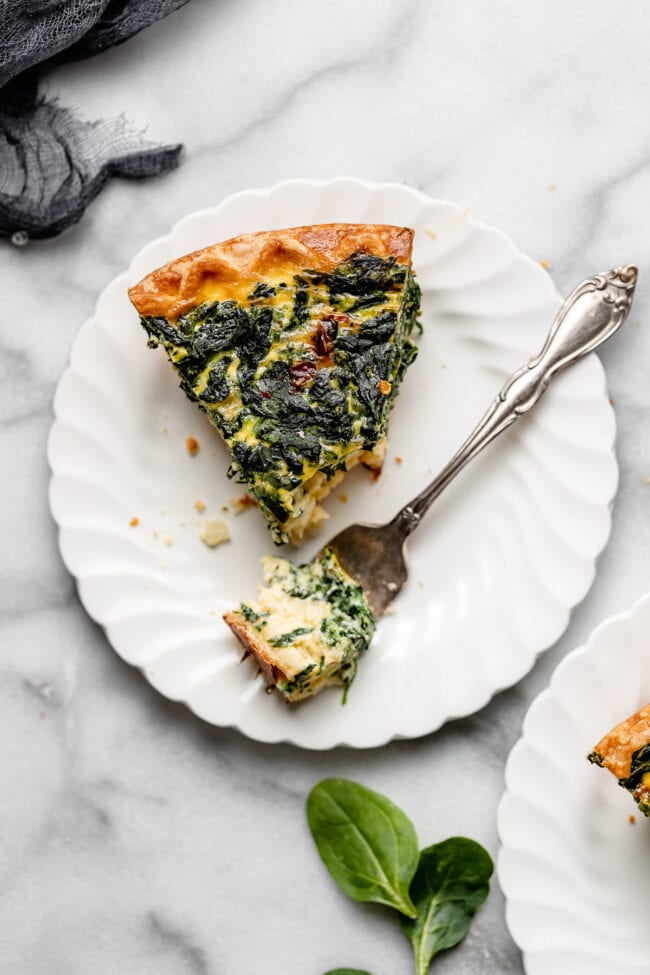 easy spinach quiche on plate with fork