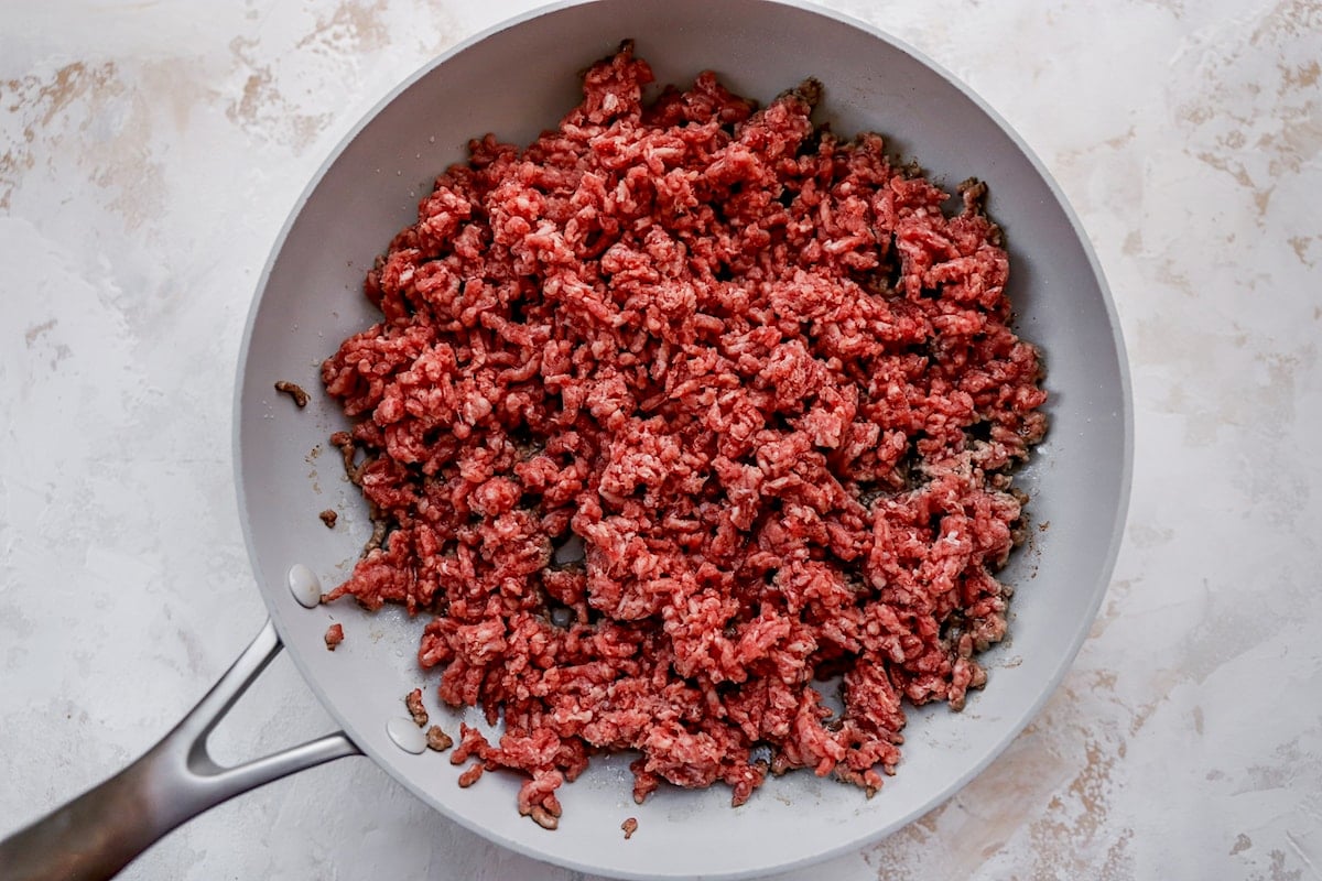 ground beef cooking in skillet for taco salad. 