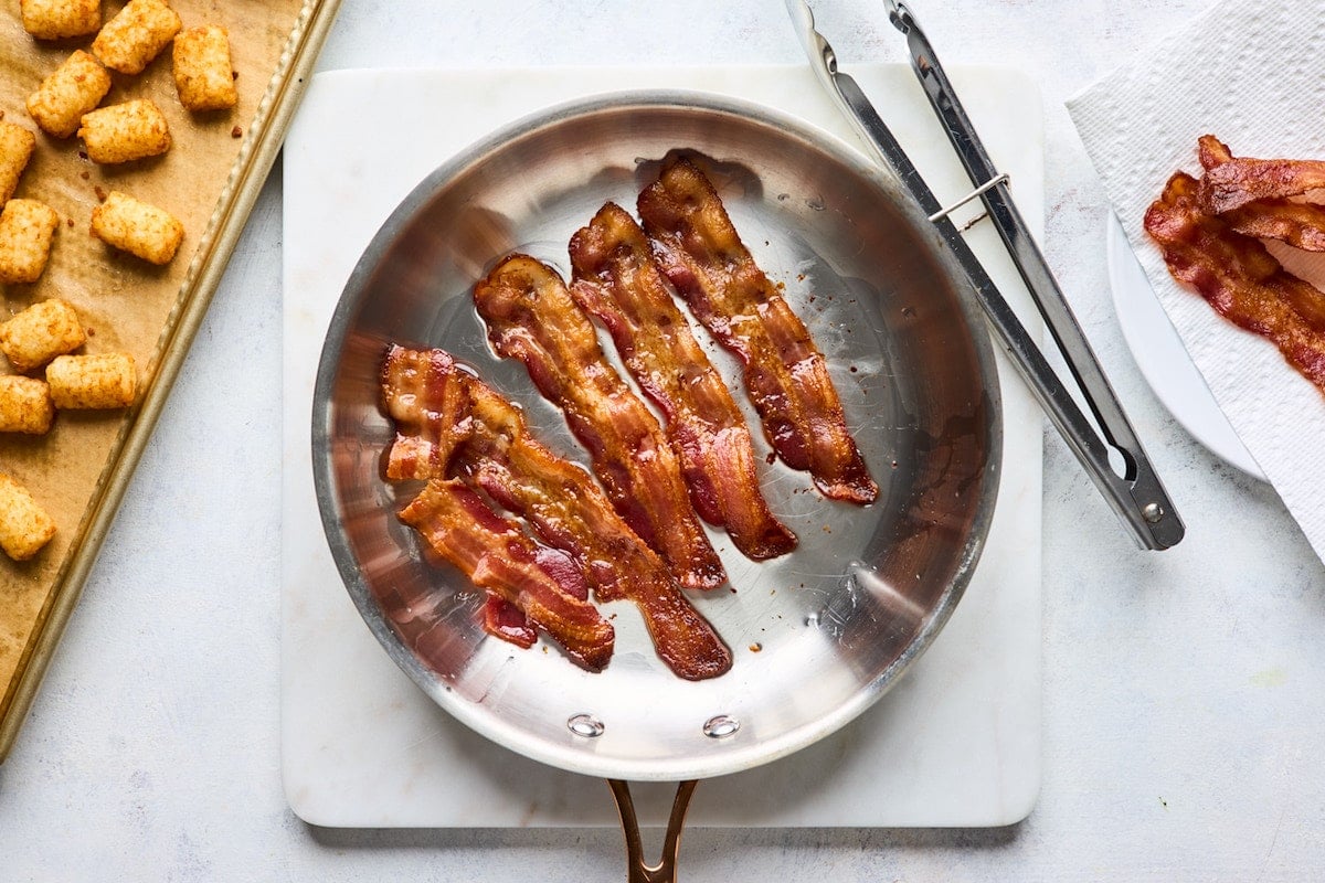 bacon cooking in skillet. 