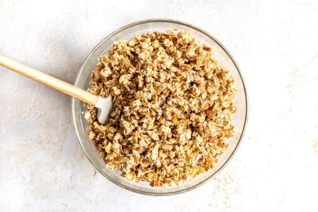 lemon blueberry granola in bowl with spatula.