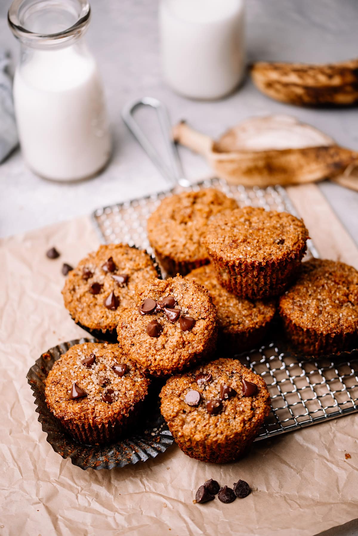 easy healthy banana muffins with chocolate chips on cooling rack. 