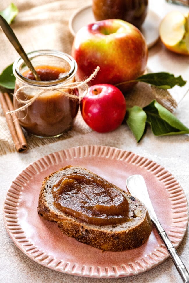 Slow Cooker Apple Butter on bread on plate.