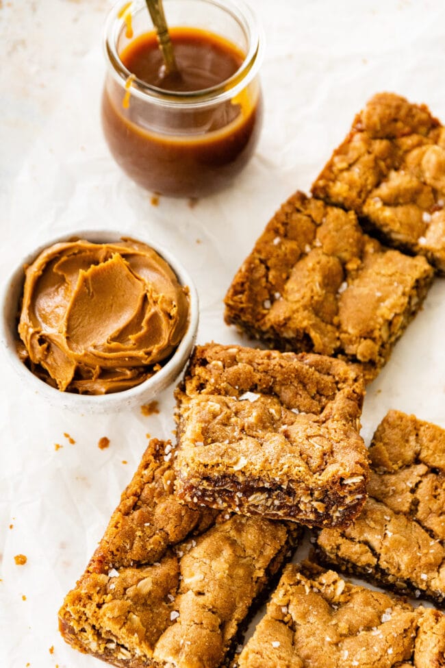 Biscoff caramel cookie bars with a bowl of cookie butter