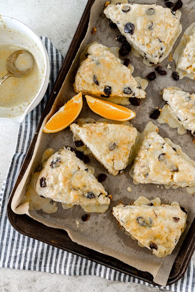 cranberry orange scones on baking sheet