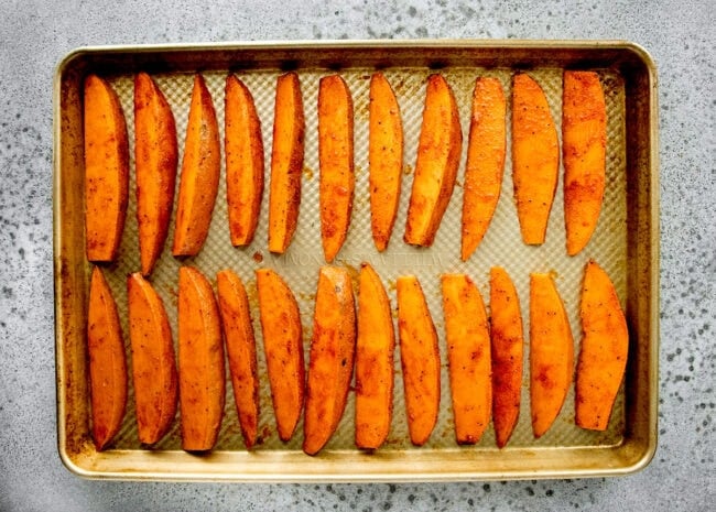 sweet potato wedges on baking sheet