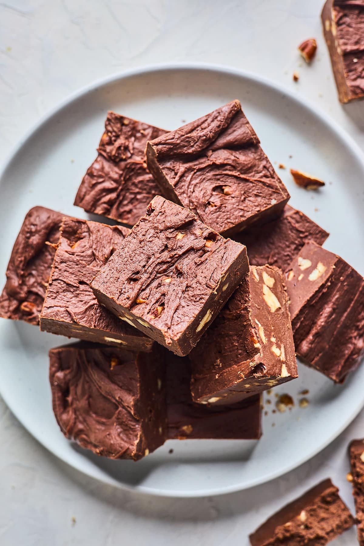 chocolate fudge squares on a plate.