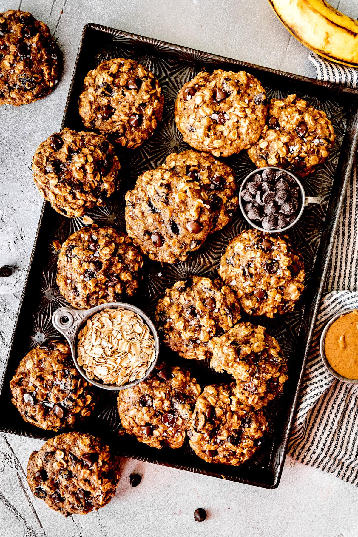 breakfast cookies with oatmeal, raisins, and chocolate chips on pan. 