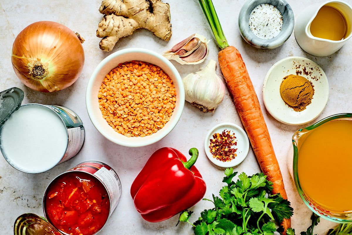 curry lentil soup ingredients in bowls. 