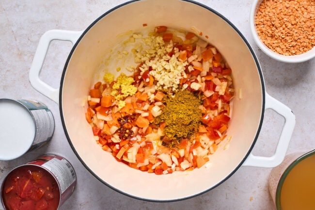 curry lentil soup ingredients in a soup pot