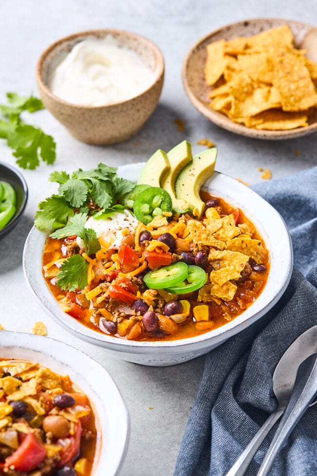 bowl of taco soup with toppings