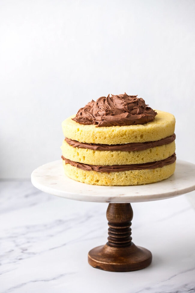 layered yellow cake with chocolate frosting