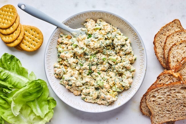 chickpea salad in bowl with spatula