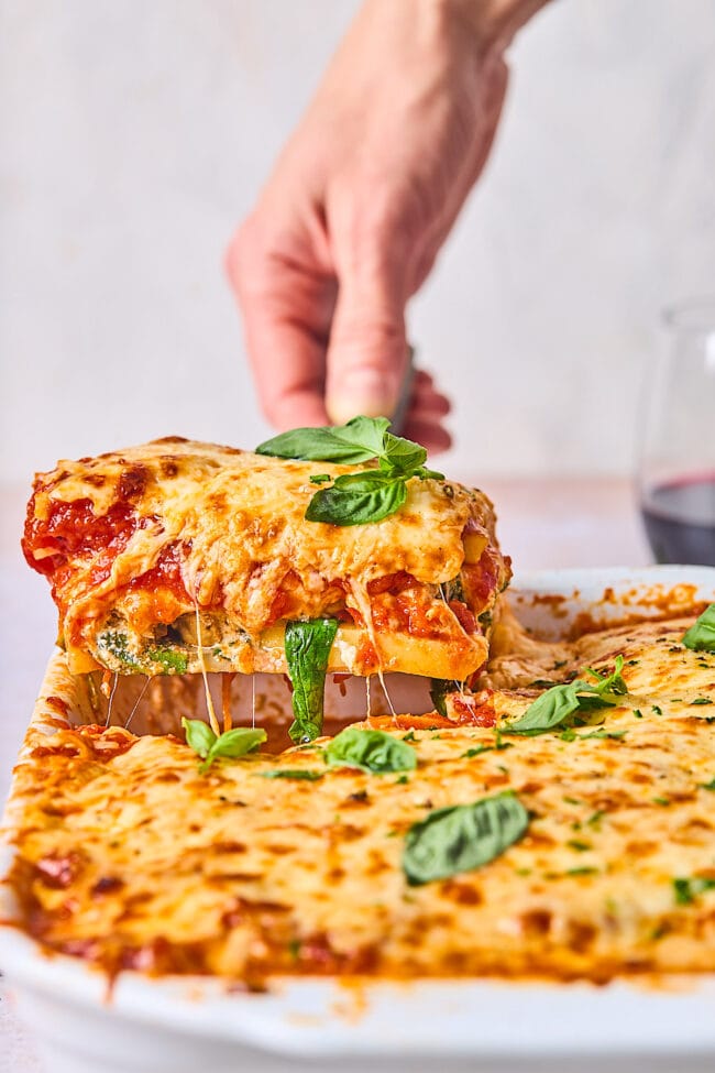 polenta lasagna being lifted out of pan with spatula