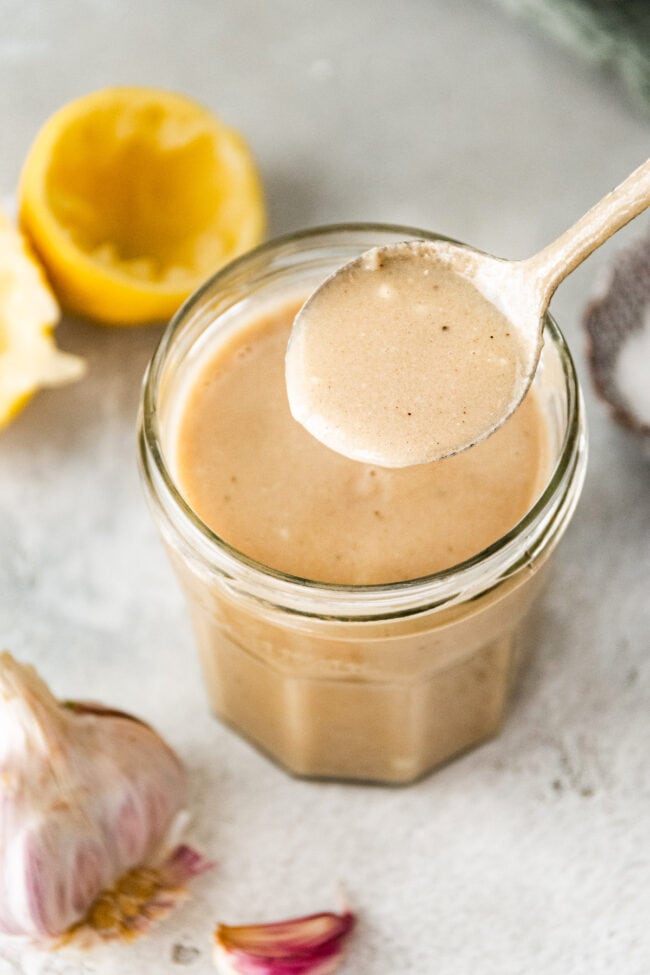 tahini dressing with spoon