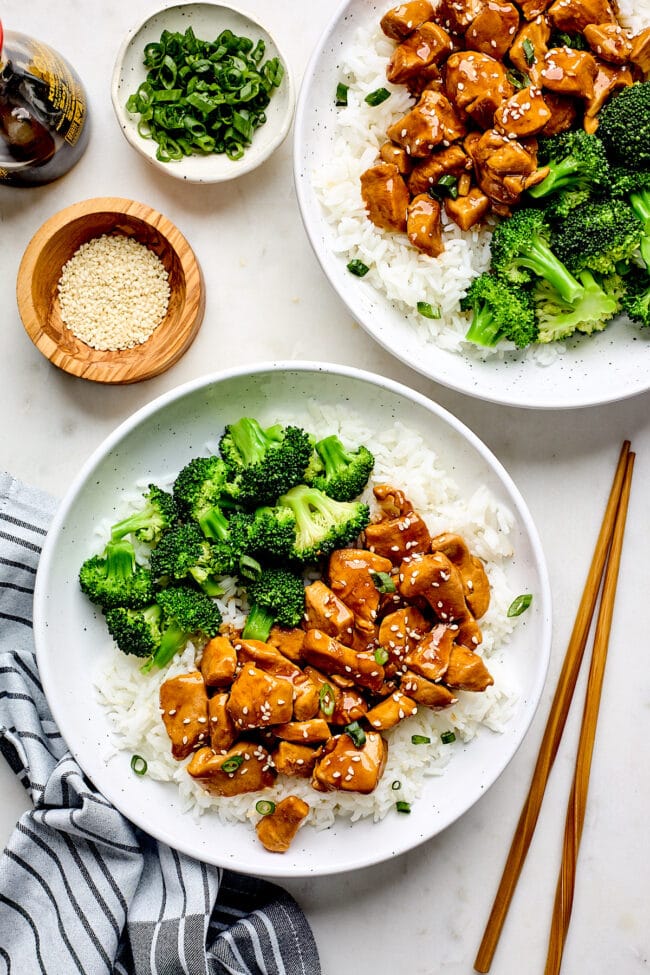 teriyaki chicken on plate with rice, broccoli, and sesame seeds