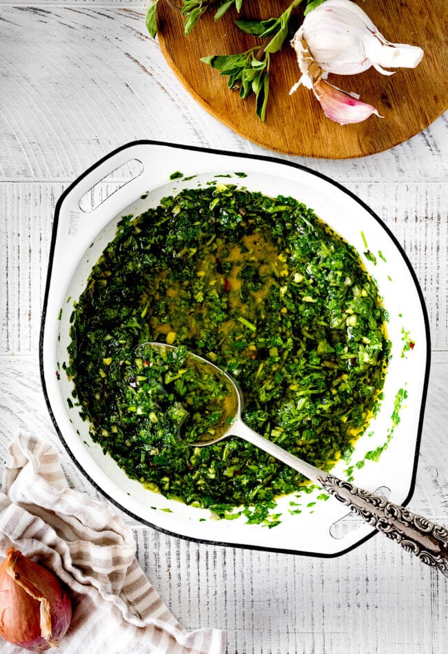 chimichurri sauce in bow with spoon.