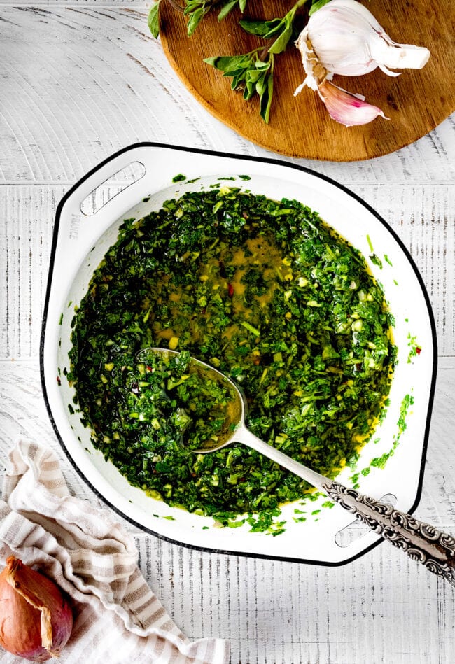 chimichurri sauce in bowl with spoon