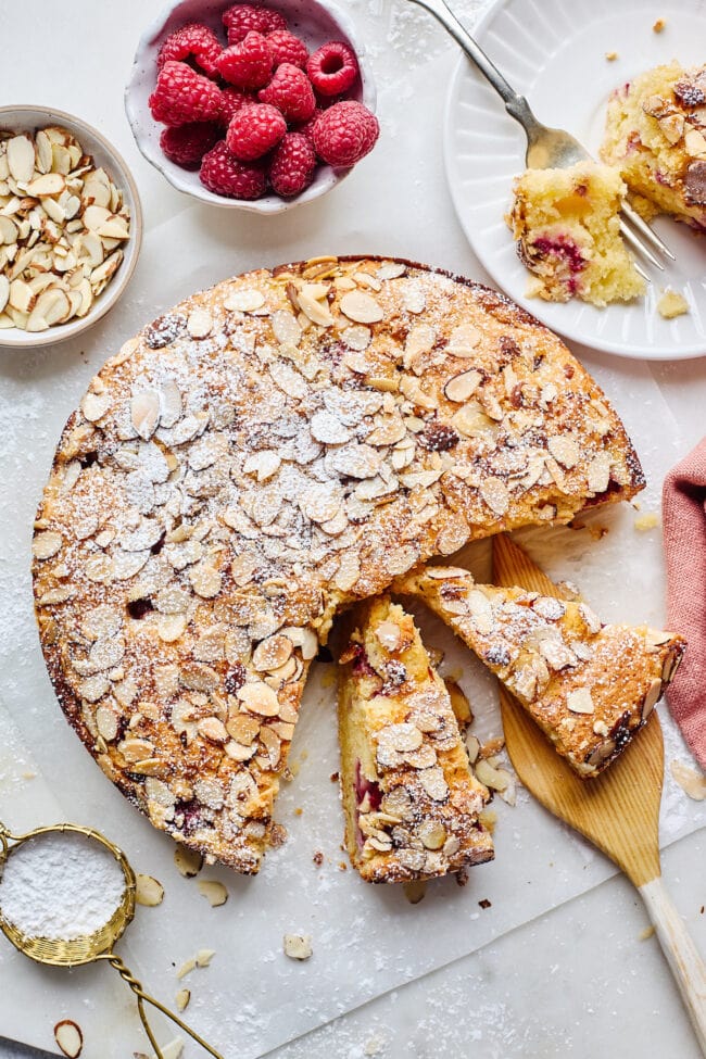 raspberry almond ricotta cake cut into slices