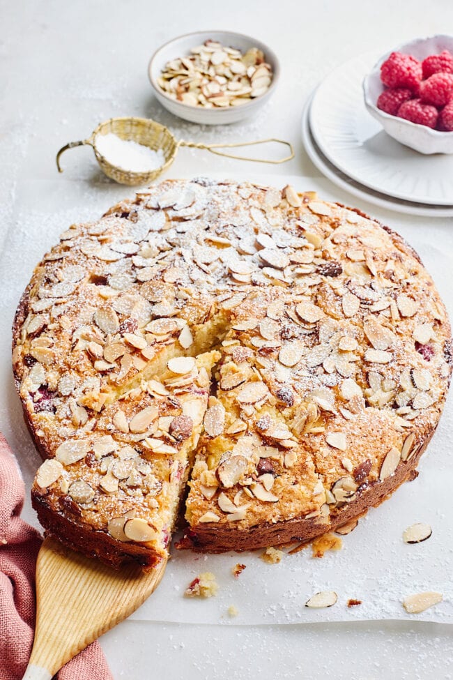 raspberry ricotta almond cake with confectioner's sugar