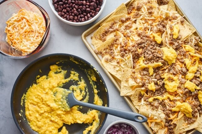 breakfast nachos with scrambled eggs, sausage, and beans