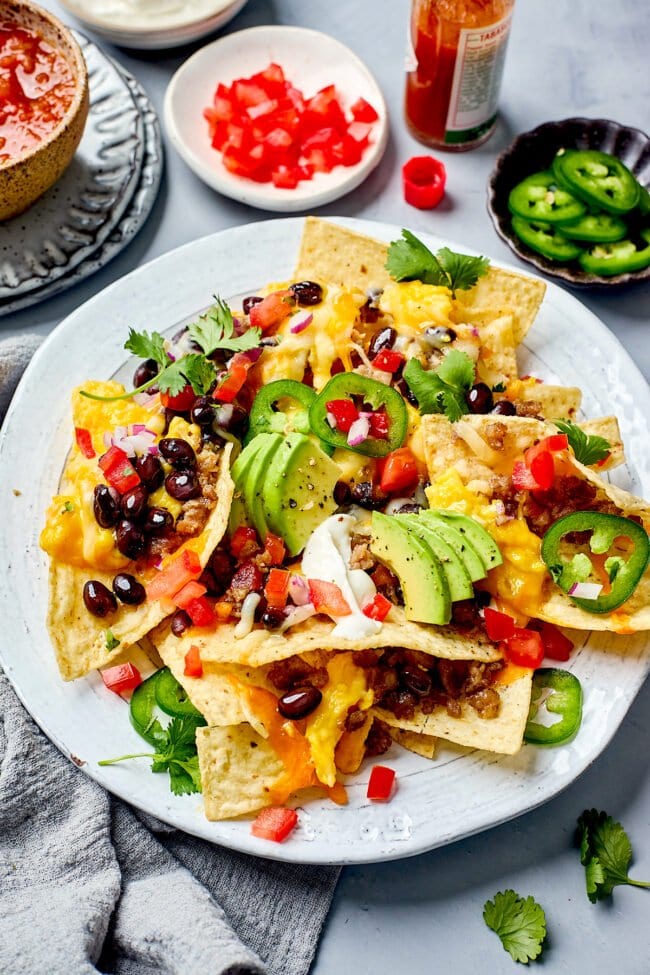 breakfast nachos on plate with toppings