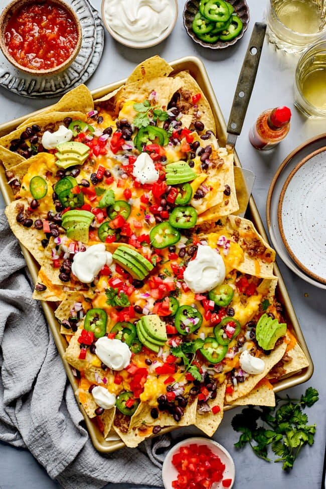 breakfast nachos on sheet pan with toppings