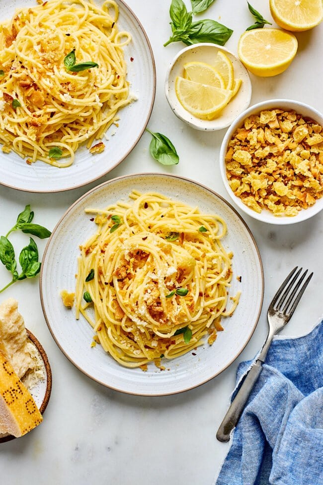 lemon spaghetti with garlic breadcrumbs on plates