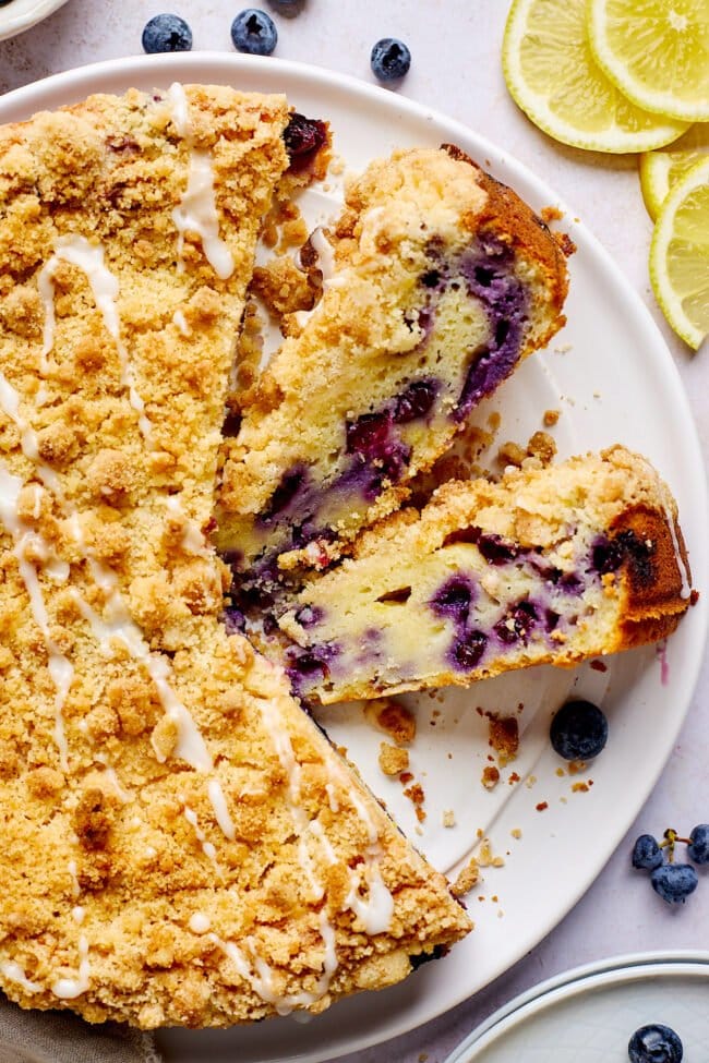 lemon blueberry ricotta cake cut in pieces.