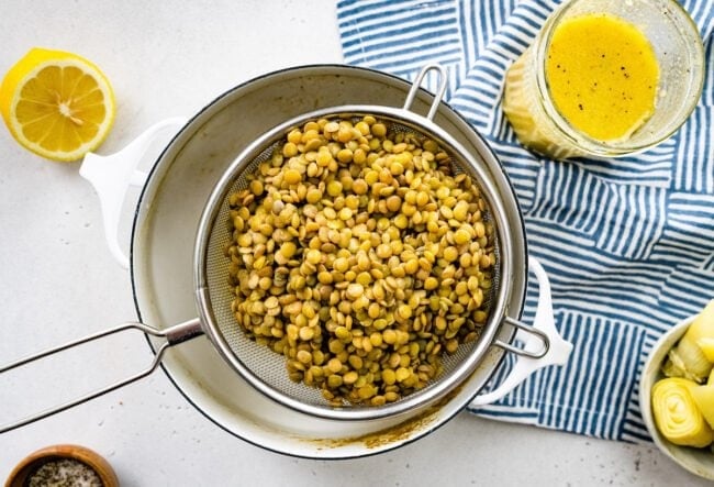 lentils in strainer for spring lentil salad.