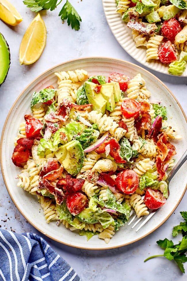 BLT pasta salad on plate with fork.