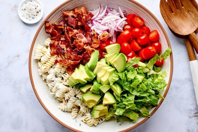 BLT pasta salad ingredients in bowl.