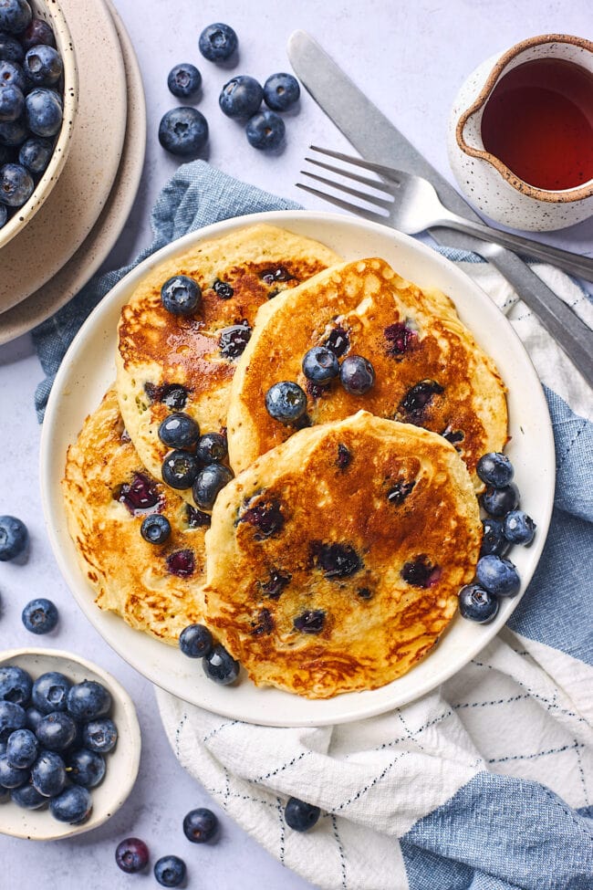 blueberry pancakes on plate.